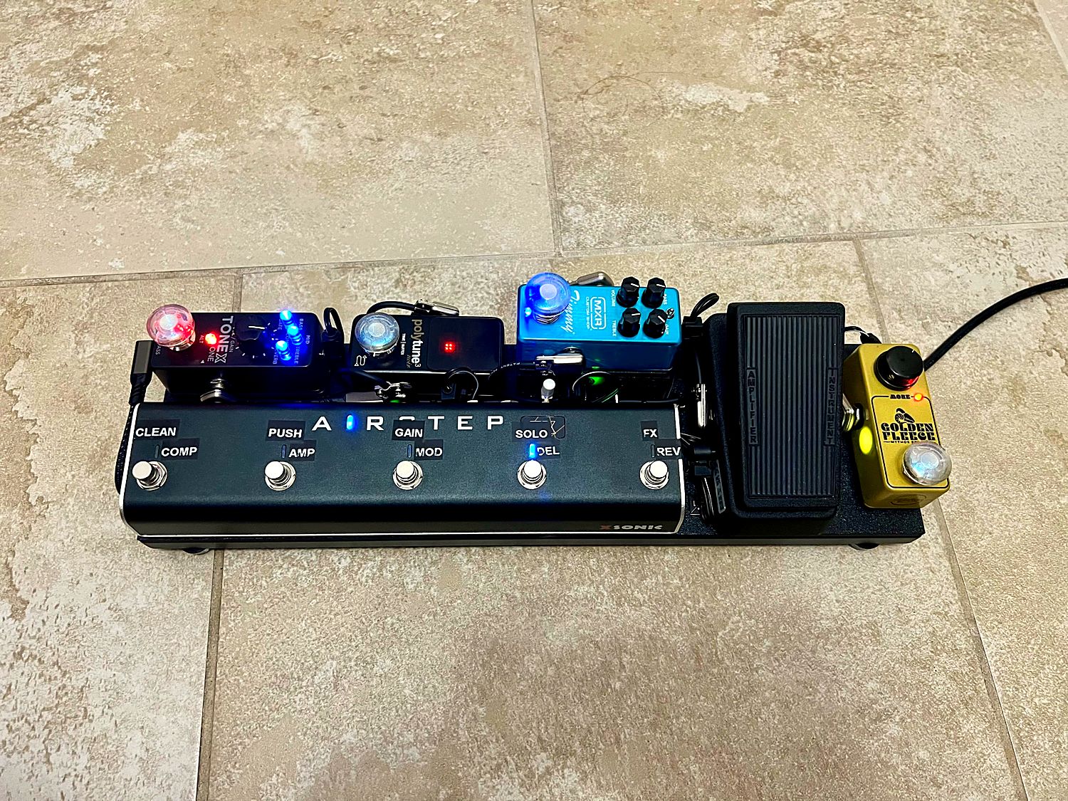 Compact pedalboard with a five-switch controller and mini pedals